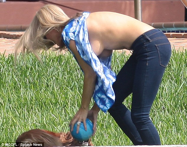 Joanna Krupa playing with her dog