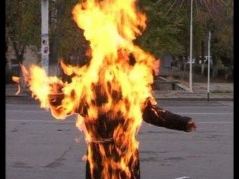 Woman set ablaze at police station dies