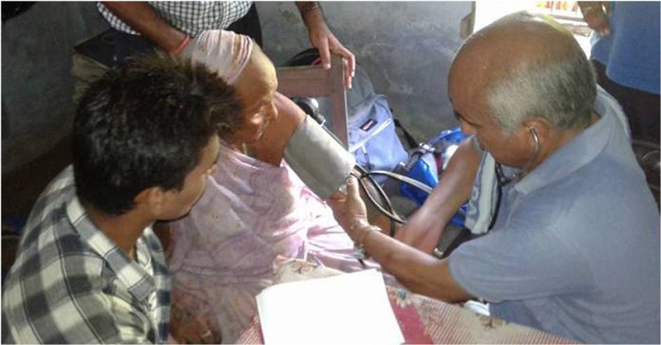 Dr KC providing free medical treatment in Rolpa