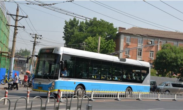 Electric buses run on Beijing street