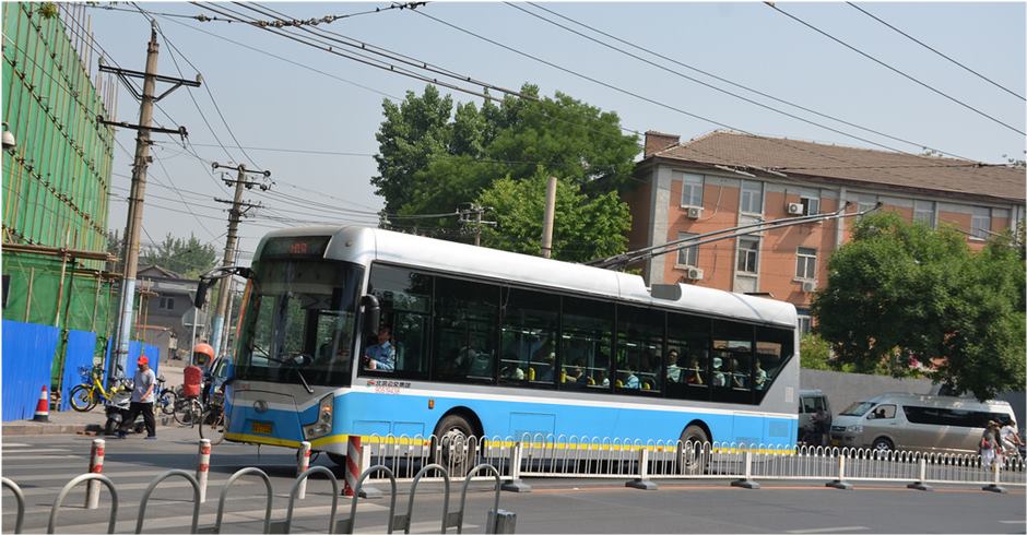 Electric buses run on Beijing street